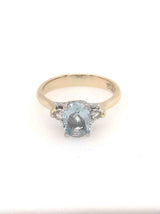 9CT YELLOW AND WHITE GOLD TRILOGY DRESS RING CLAW SET OVAL CUT AQUAMARINE AND DIAMONDS HAND CRAFTED